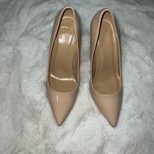 Nude patent pumps